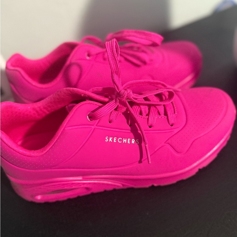 Hot pink Skechers sneakers